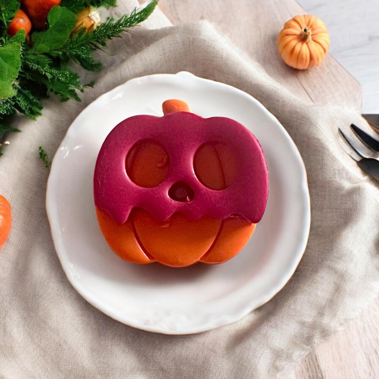 Layered skull pumpkin clay piece on white plate
