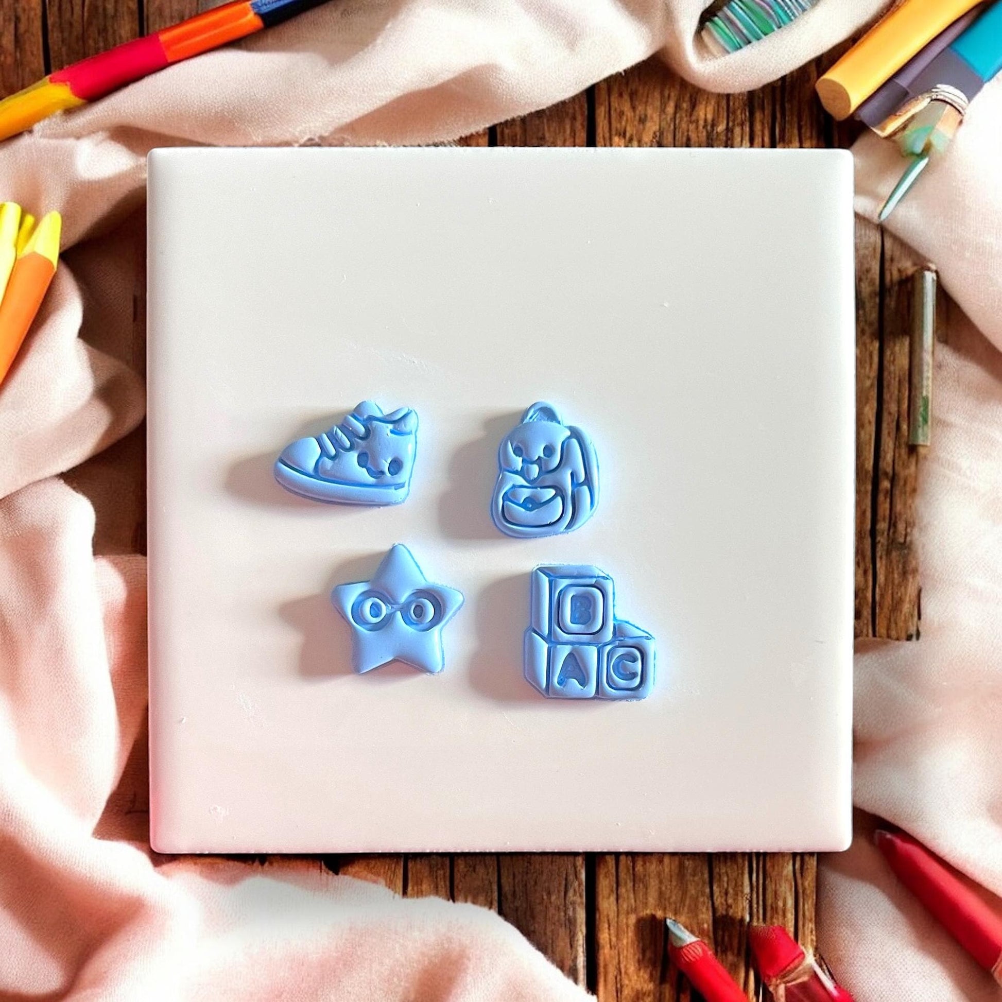 blue molded school clay studs