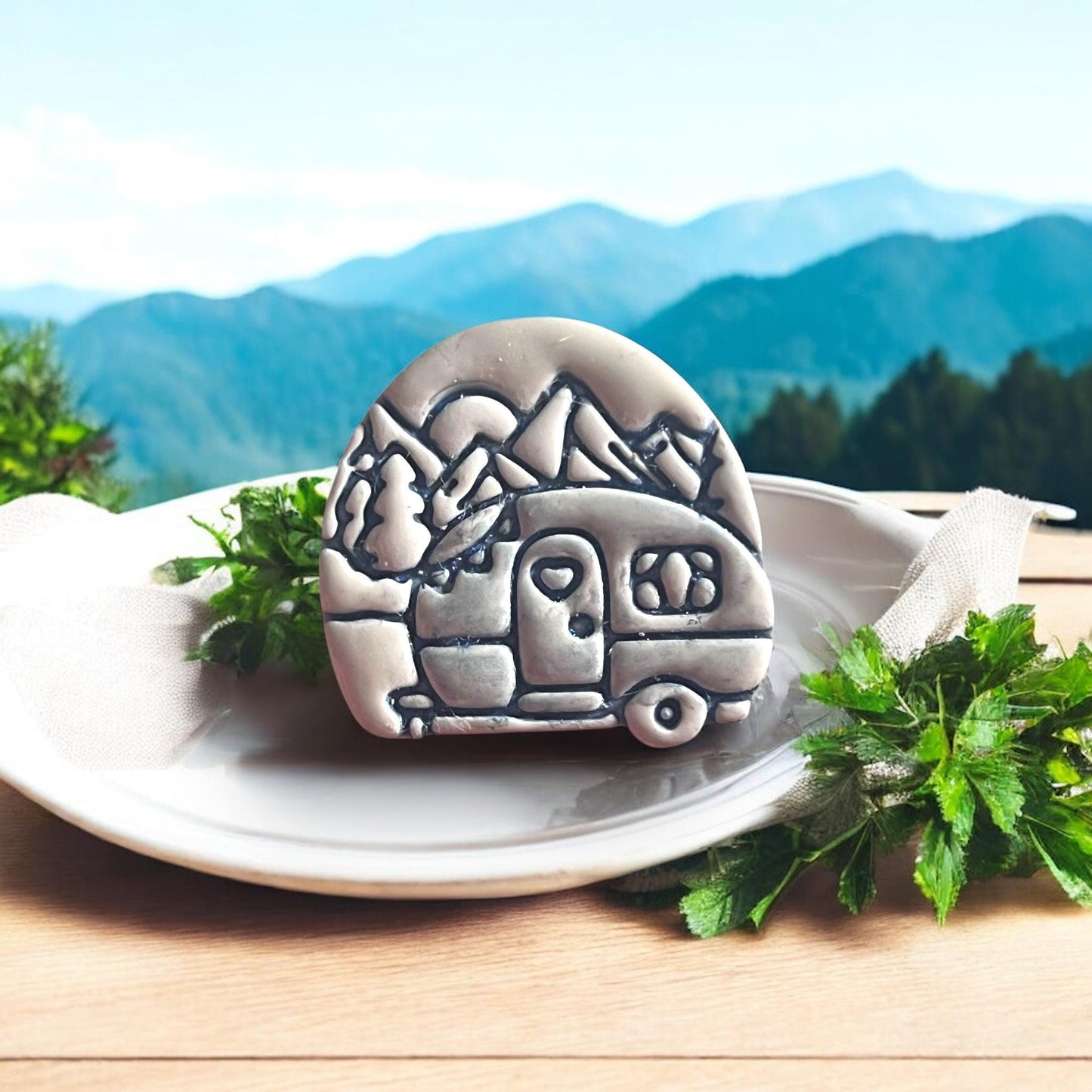 camping van clay shape with mountain background