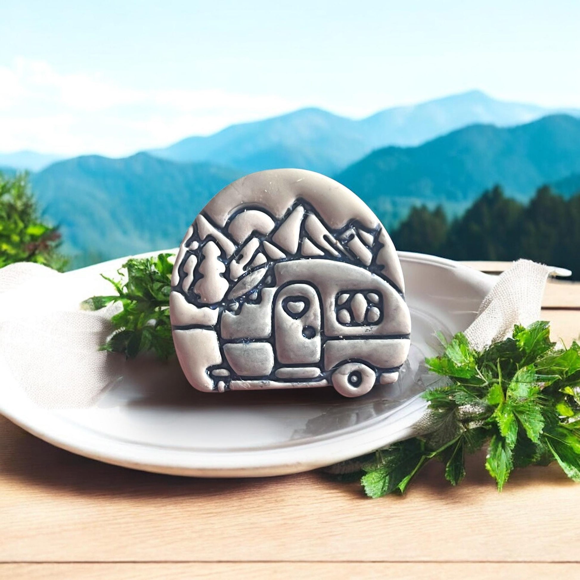 camping van clay shape with mountain background