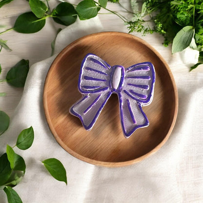 finished clay earring shaped like a girly ribbon bow