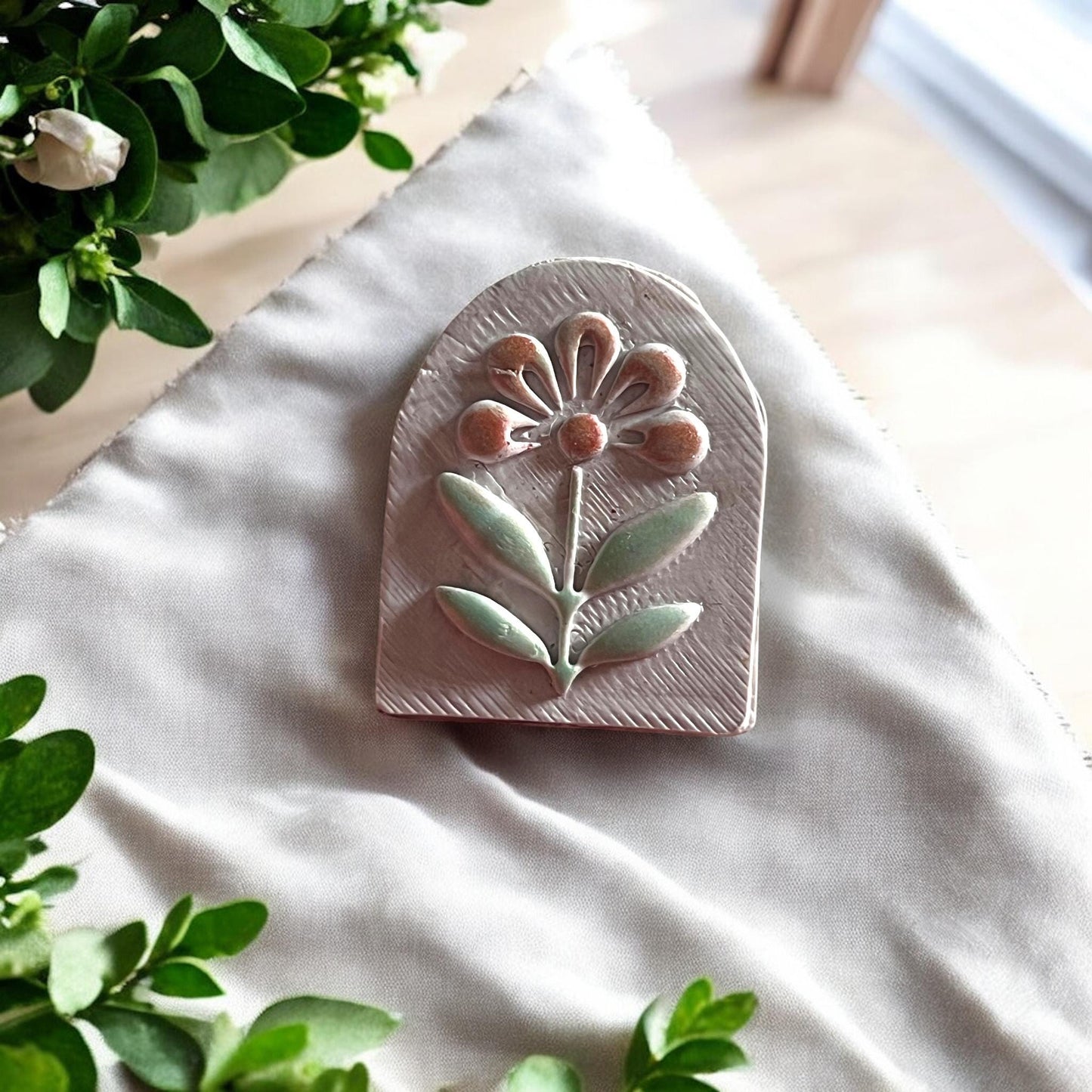 Finished floral arch dangle in polymer clay on fabric