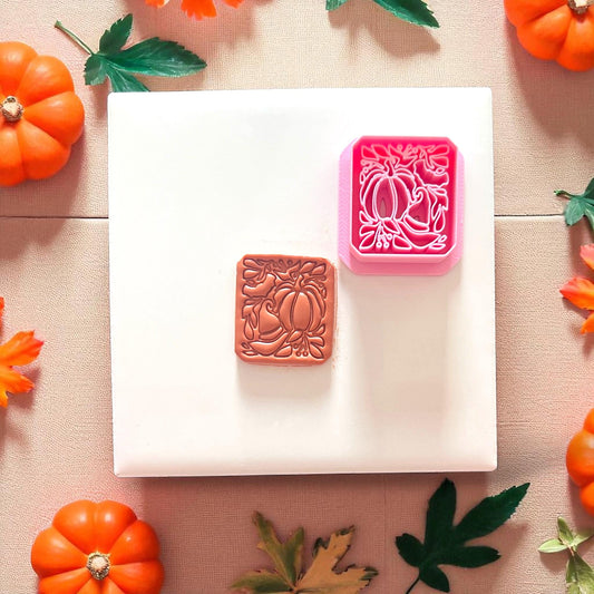 pink polymer clay cutter with pumpkin and witch hat design
