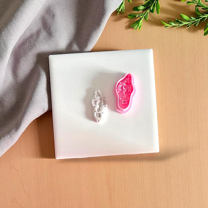 polymer clay cutter and matching impression of melting clock design