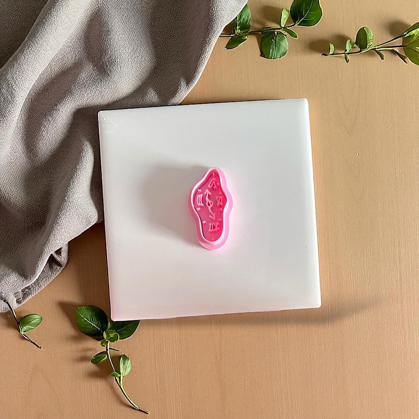 pink melting clock cutter for polymer clay