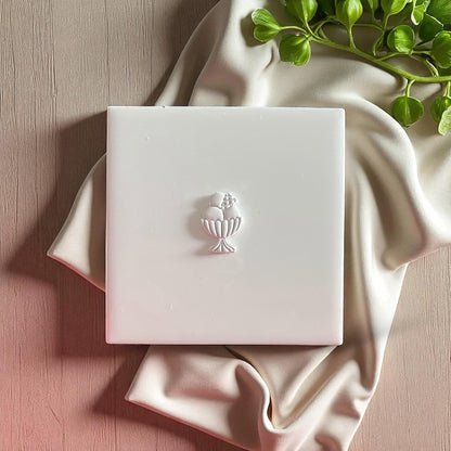 Clay sundae mold on white base with soft fabric