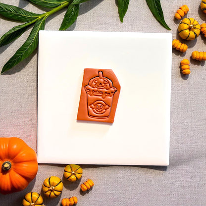 Close-up of spooky boba clay imprint showing ghost and pumpkin drink details