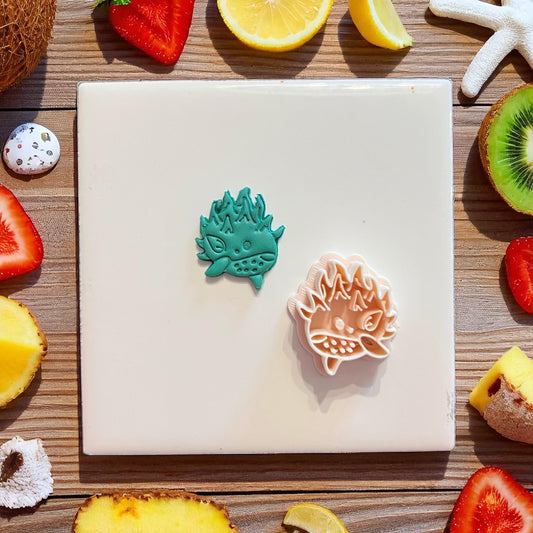 Cutter and stamped pomegranate whale design with fruit background