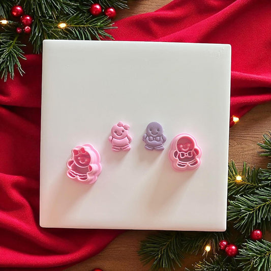 Gingerbread stud cutters next to finished pieces