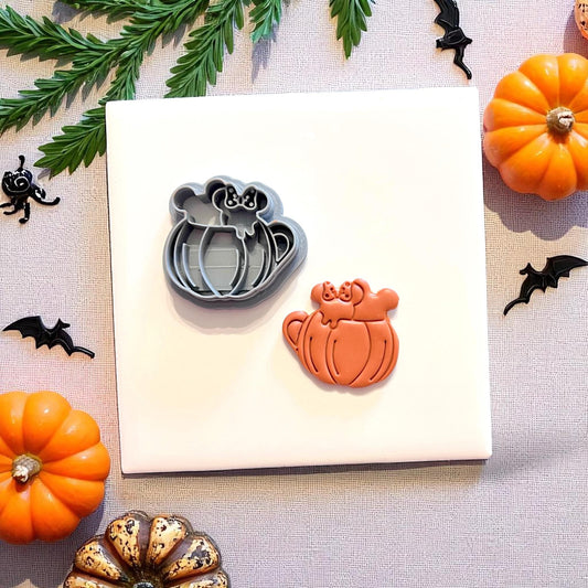 Fall drink clay cutter next to matching cutout on white tile