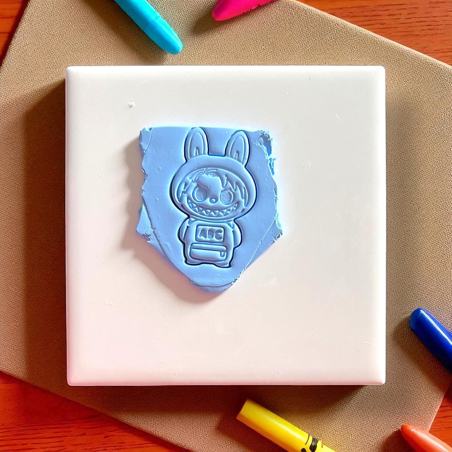 monster character clay impression with abc block