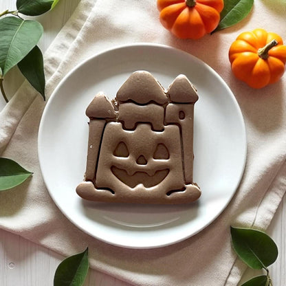 angled view of halloween castle clay piece with pumpkins
