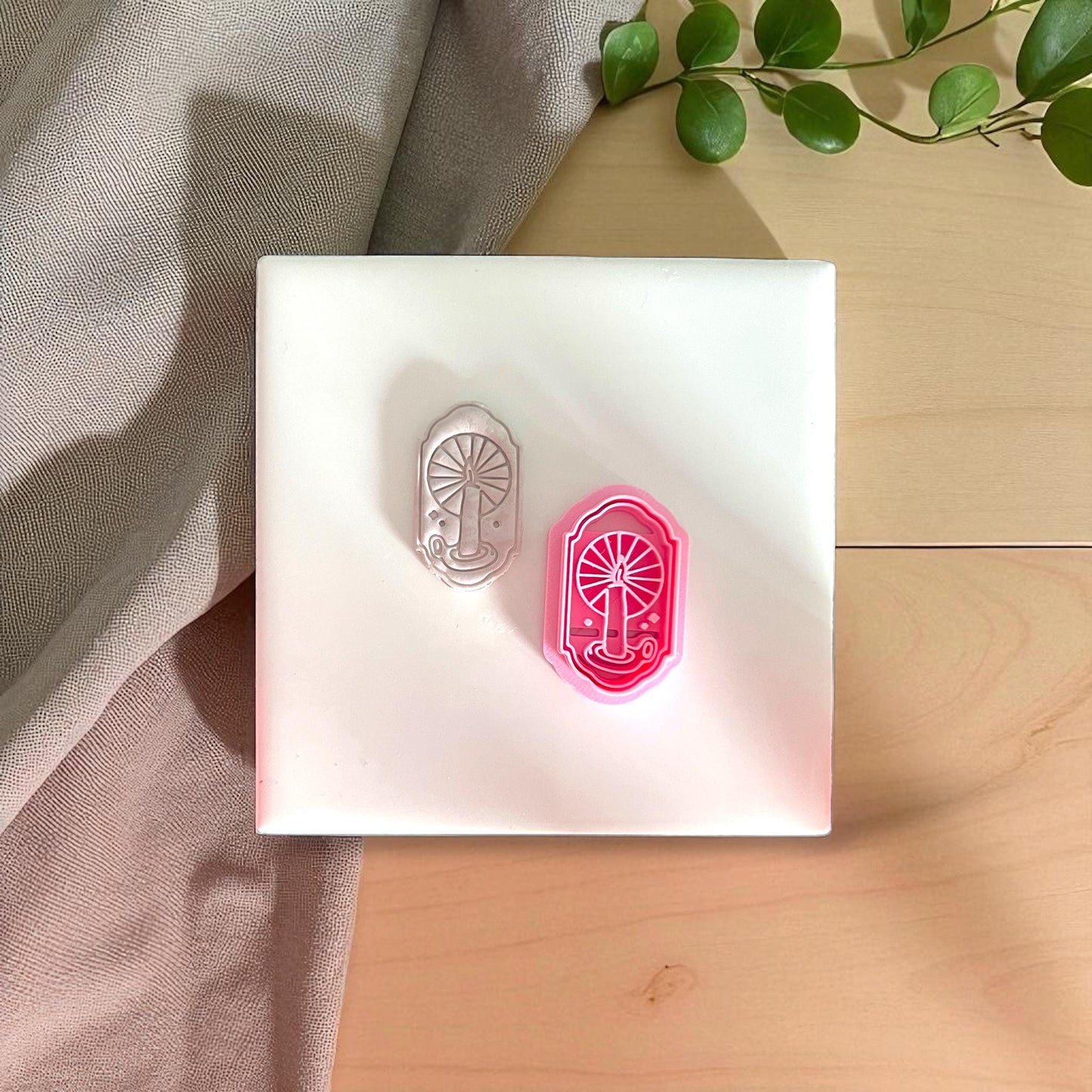 pink cutter and matching candle window impression side by side