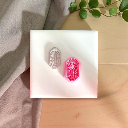 pink cutter and matching candle window impression side by side