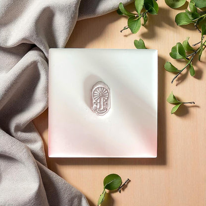 small candle window clay impression centered on white tile