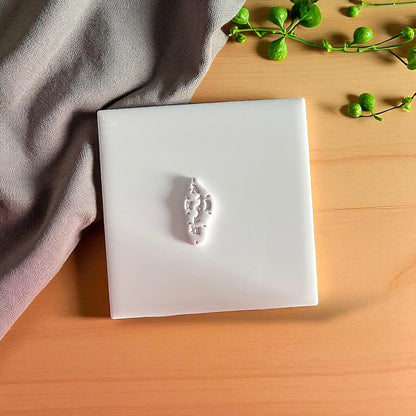 white clay impression of surreal clock shape