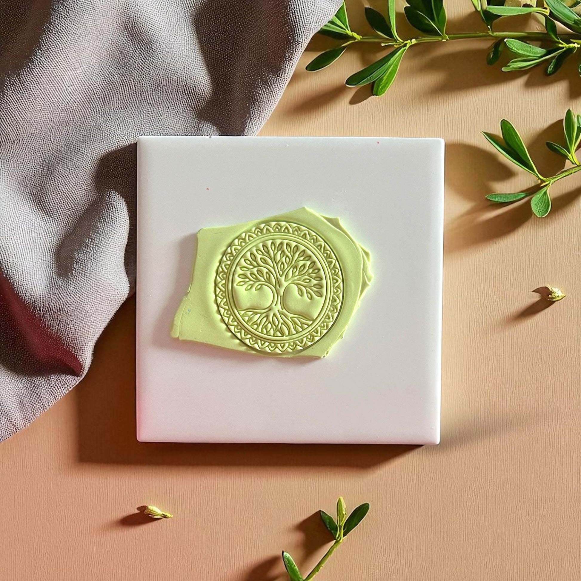 Tree of Life clay imprint with gold accents on round design