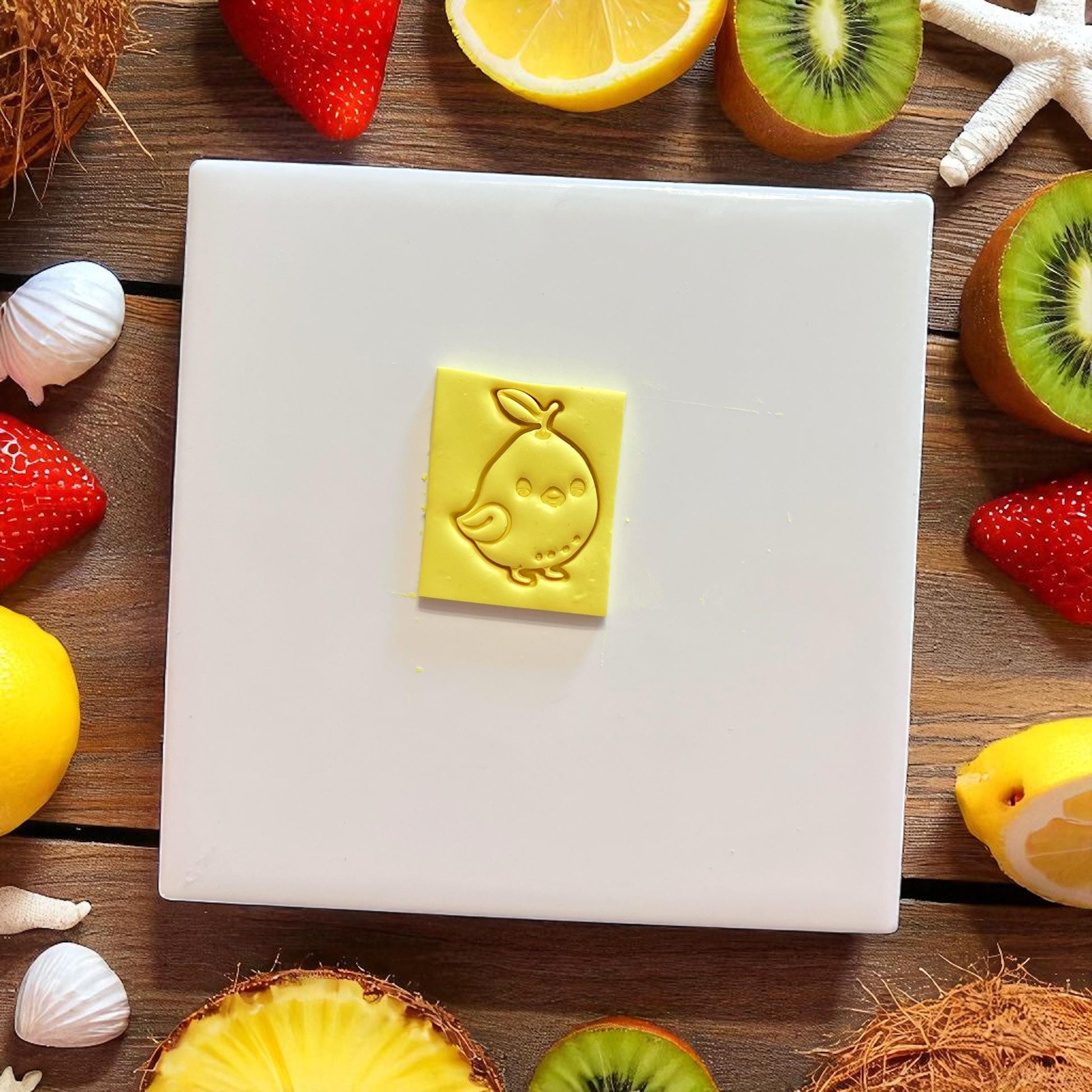 lemon chick clay cutter imprint on yellow clay slab