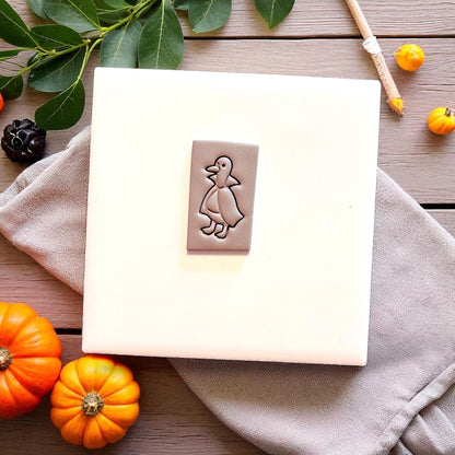 Count Duckula cutter impression in gray clay