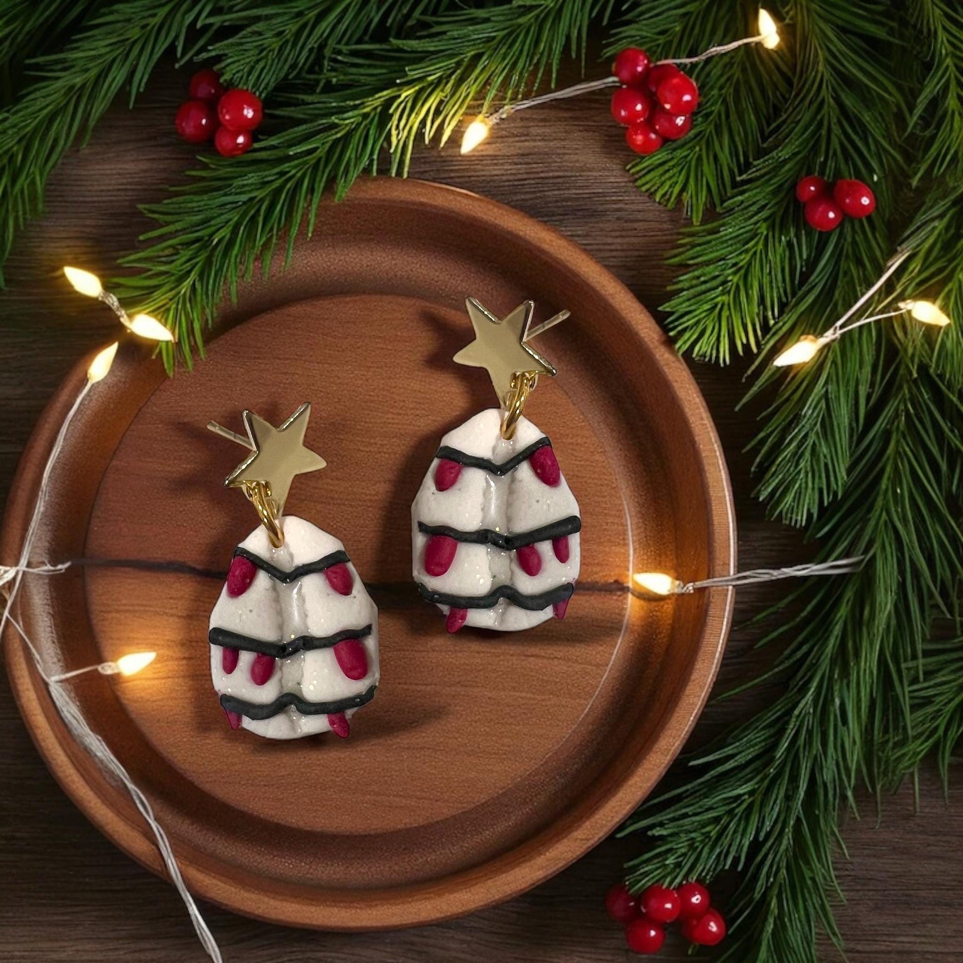 Pair of cowrie shell clay earrings with Christmas lights and gold star toppers.