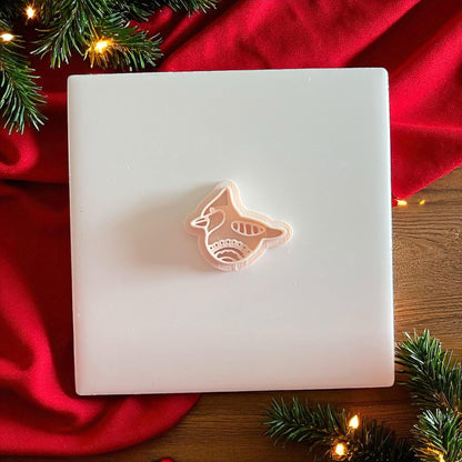Polymer clay cutter and bird imprint side by side