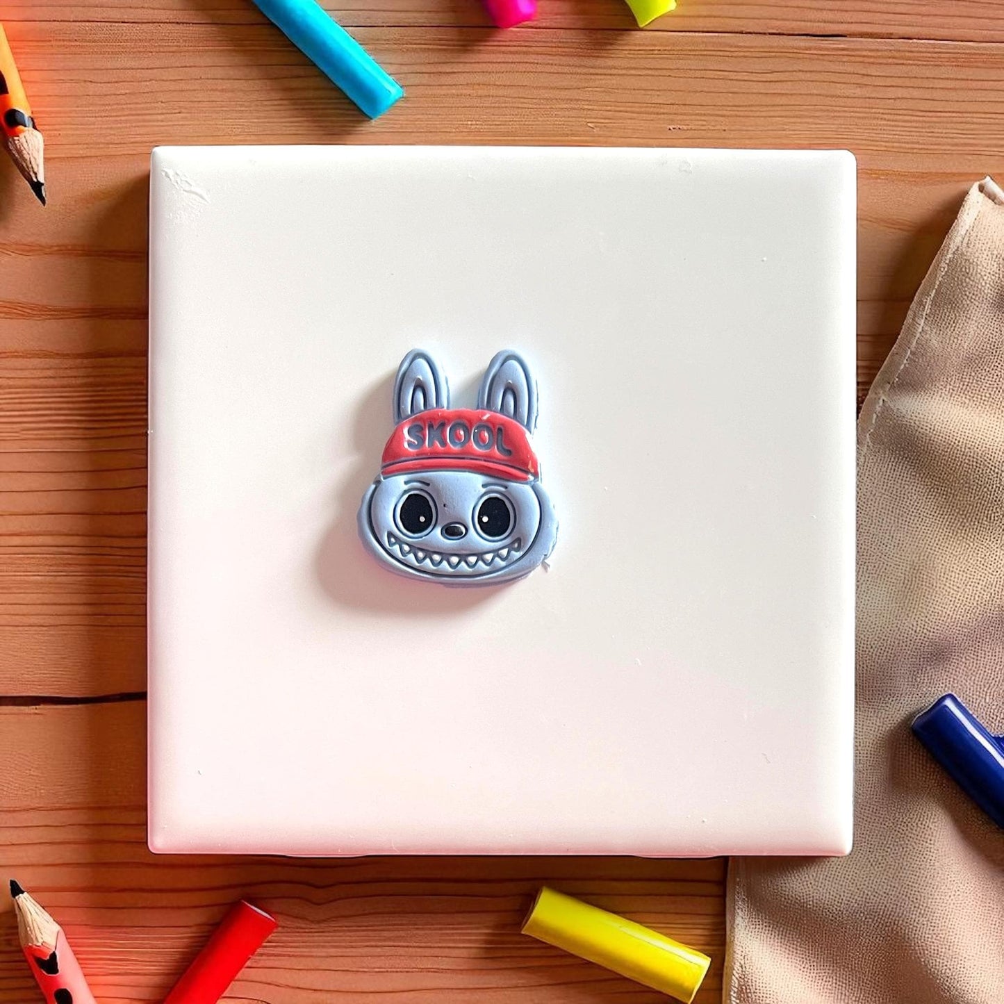 Painted SKOOL hat monster polymer clay earring piece