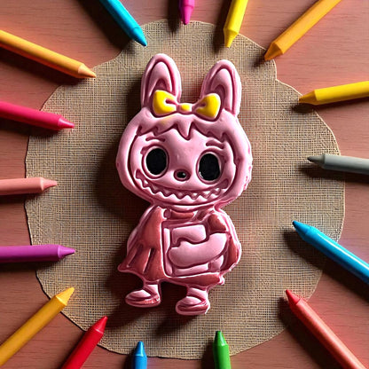 Back-to-school girl monster clay cutter surrounded by crayons