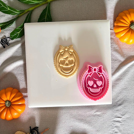 Girly skull cameo cutter and clay impression in gold and pink