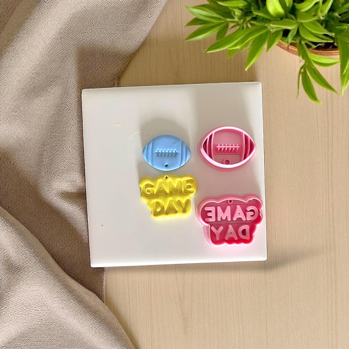 Football Game Day clay cutter set with pink and yellow clay impressions