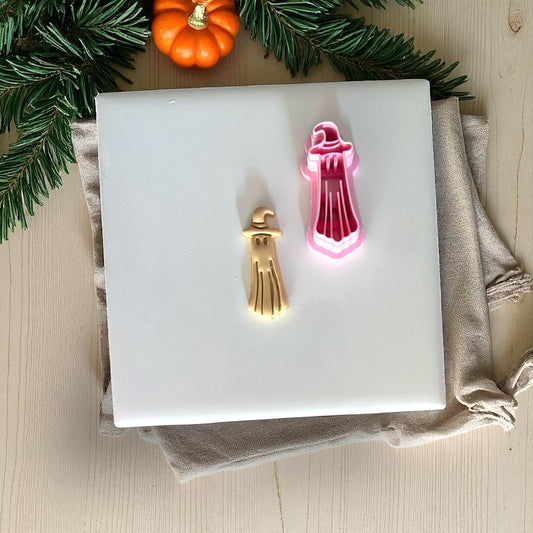 Ghost cutter next to small golden clay ghost piece