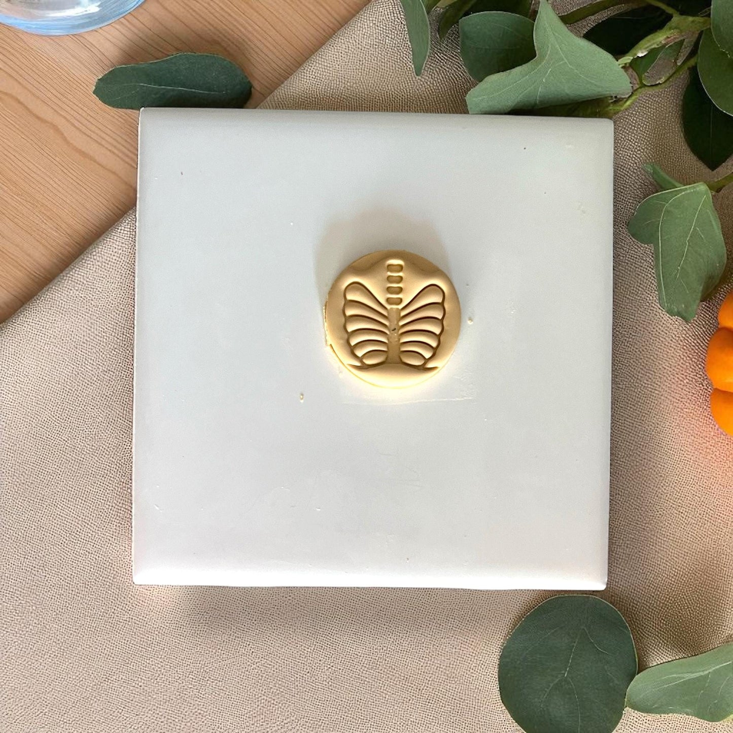 Small round golden ribcage clay piece