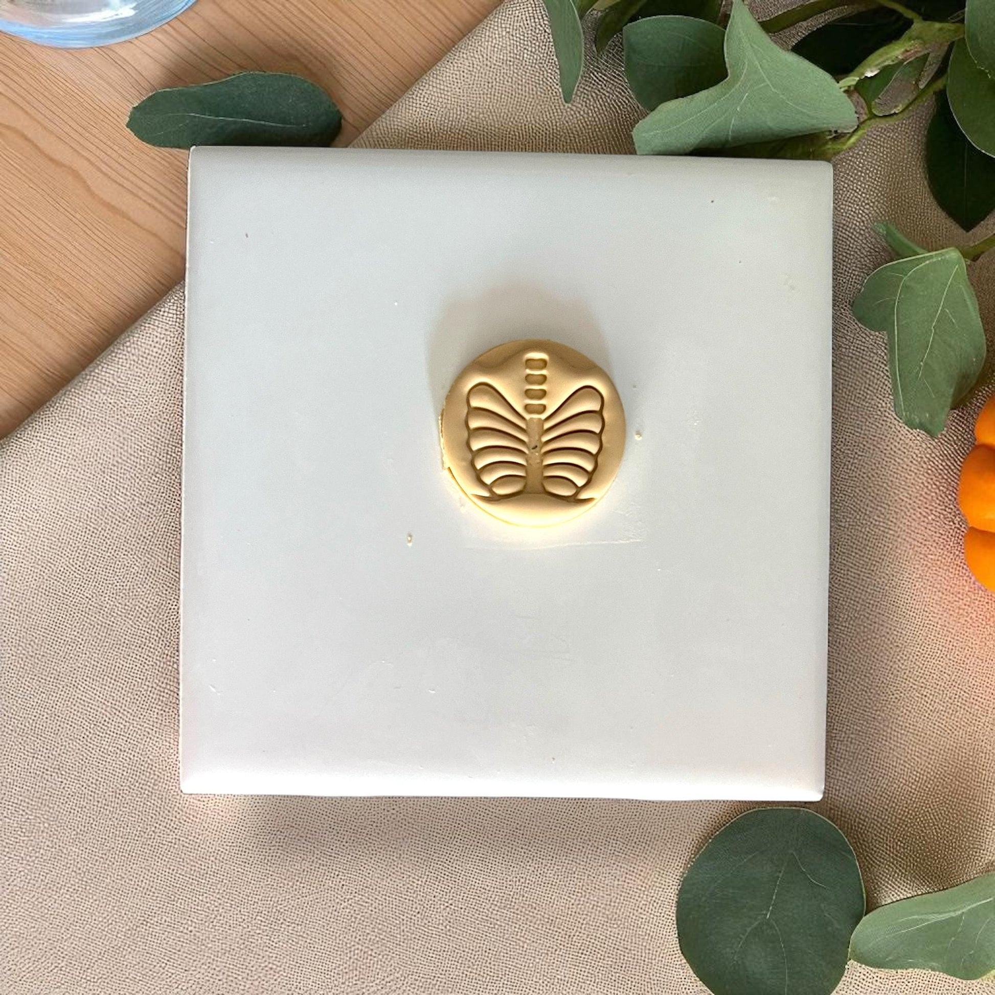 Small round golden ribcage clay piece