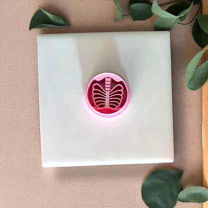 Pink ribcage skeleton clay cutter on white tile