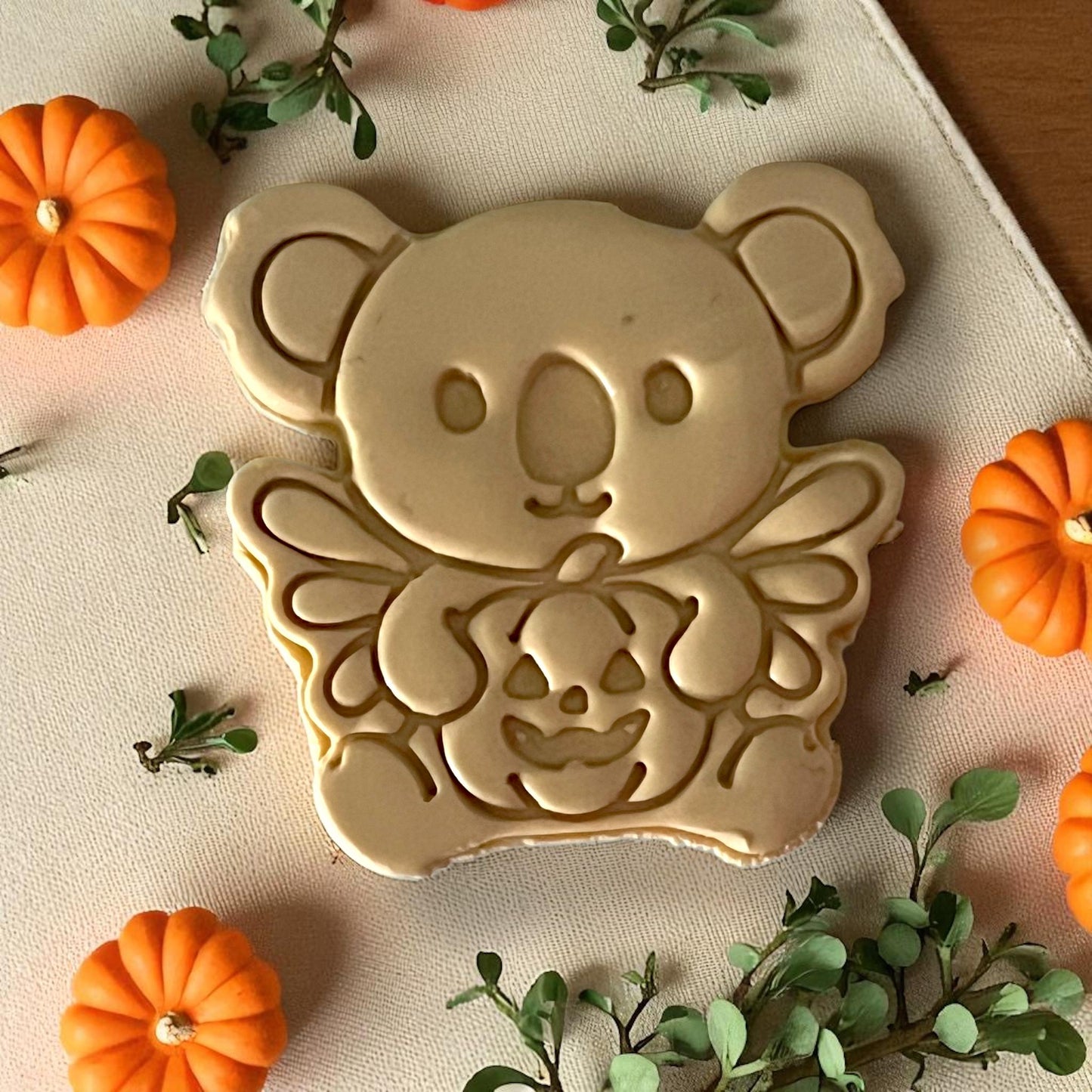 Finished golden koala with pumpkin clay piece