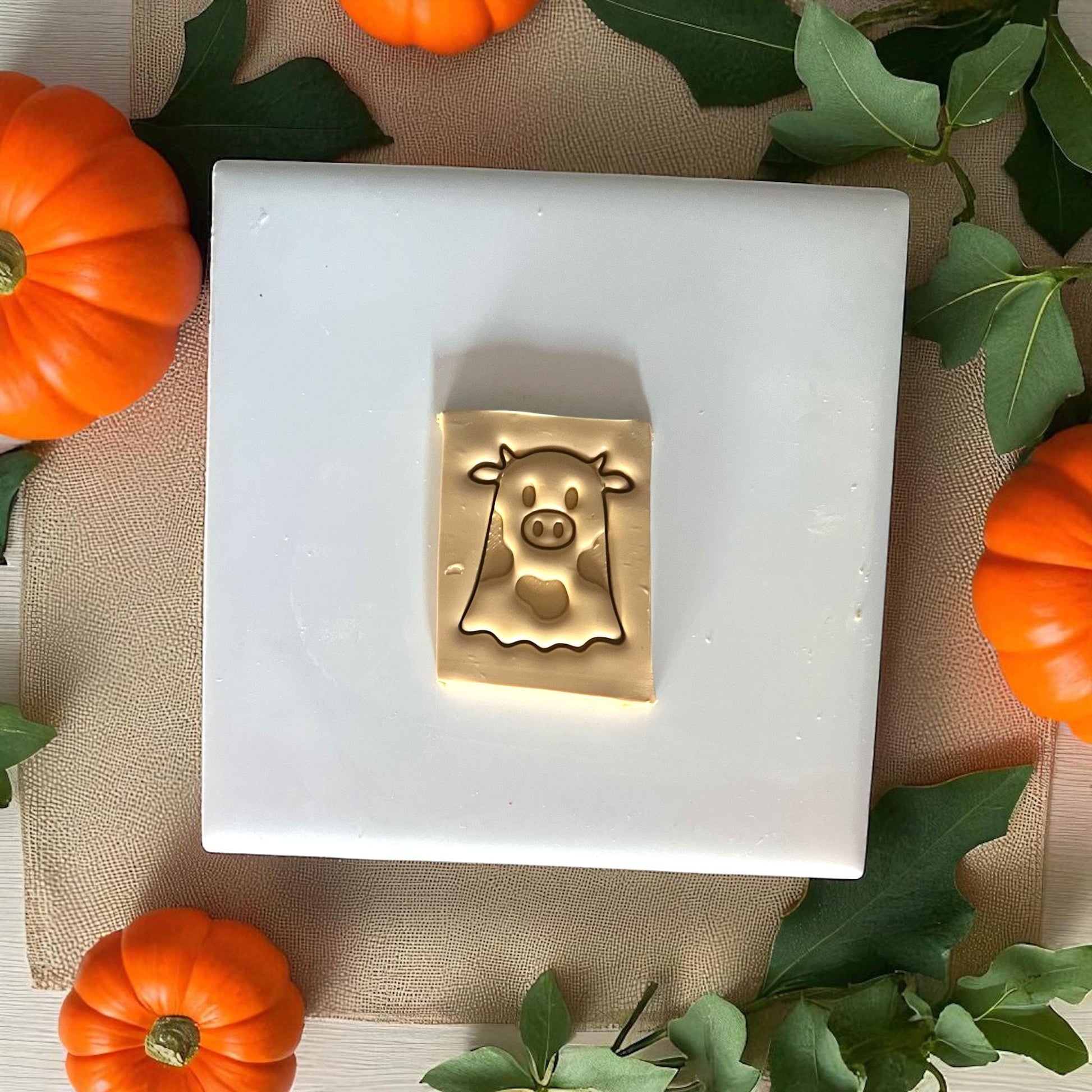 Golden ghost cow clay design with pumpkins