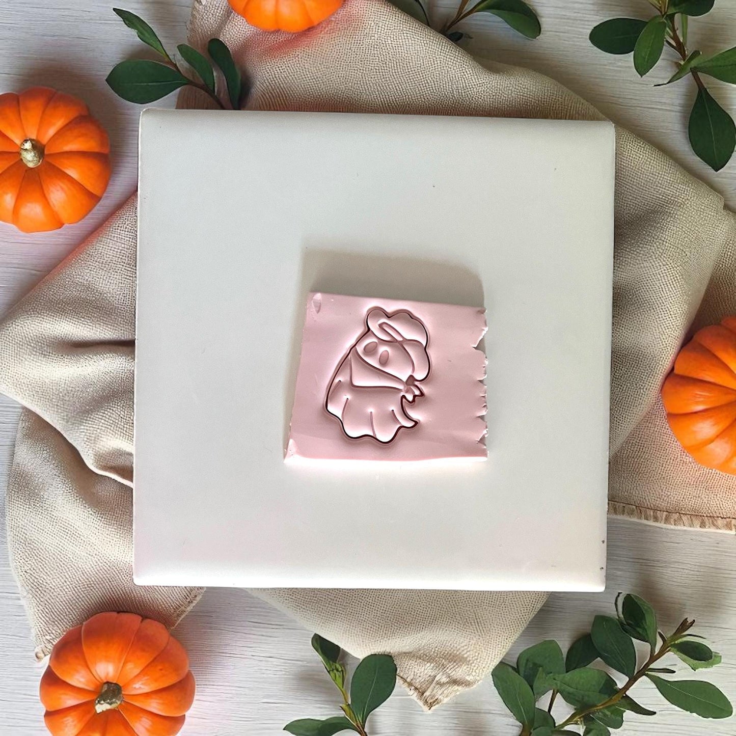 Cowboy ghost clay impression on pink clay