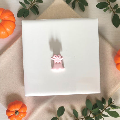 Small ghost clay piece wearing bow