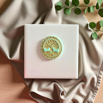 Yellow Tree of Life clay stamp on white tile with leaves