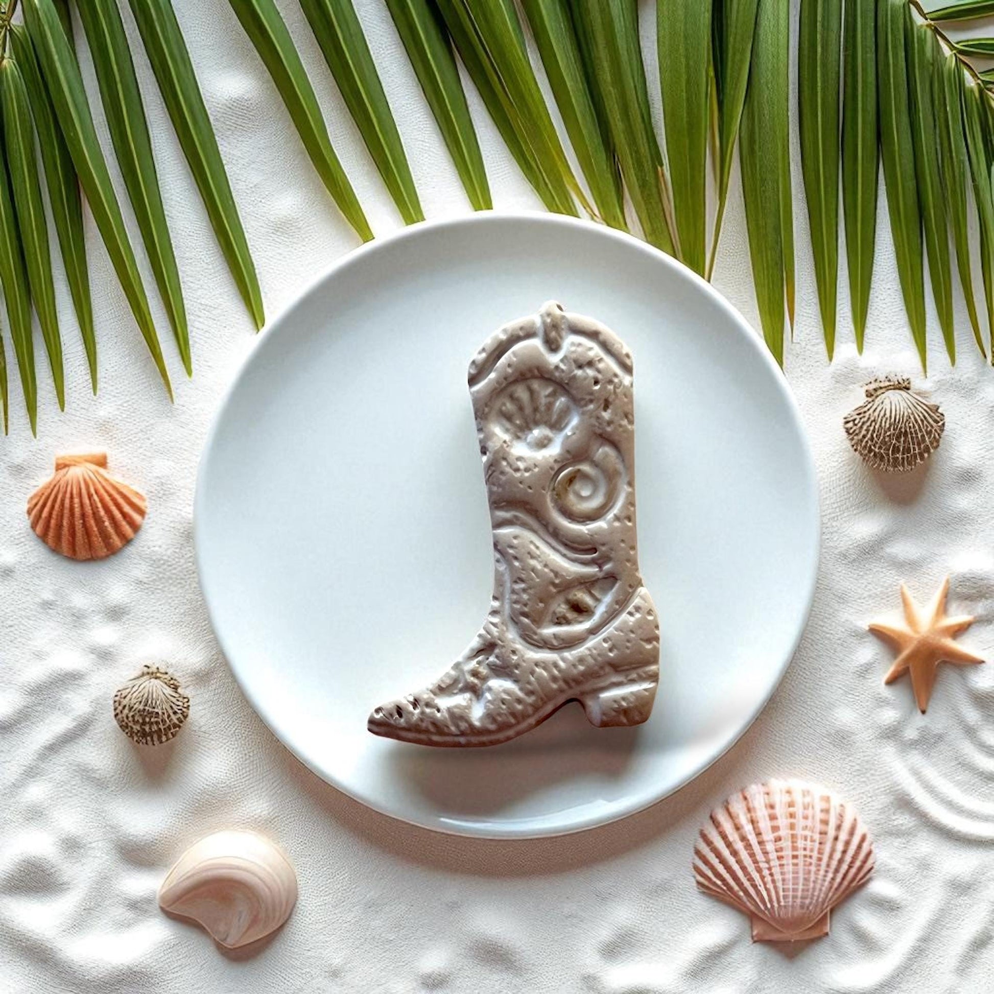 Beige coastal cowboy boot clay piece with seashells and starfish