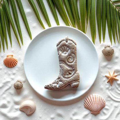 Beige coastal cowboy boot clay piece with seashells and starfish