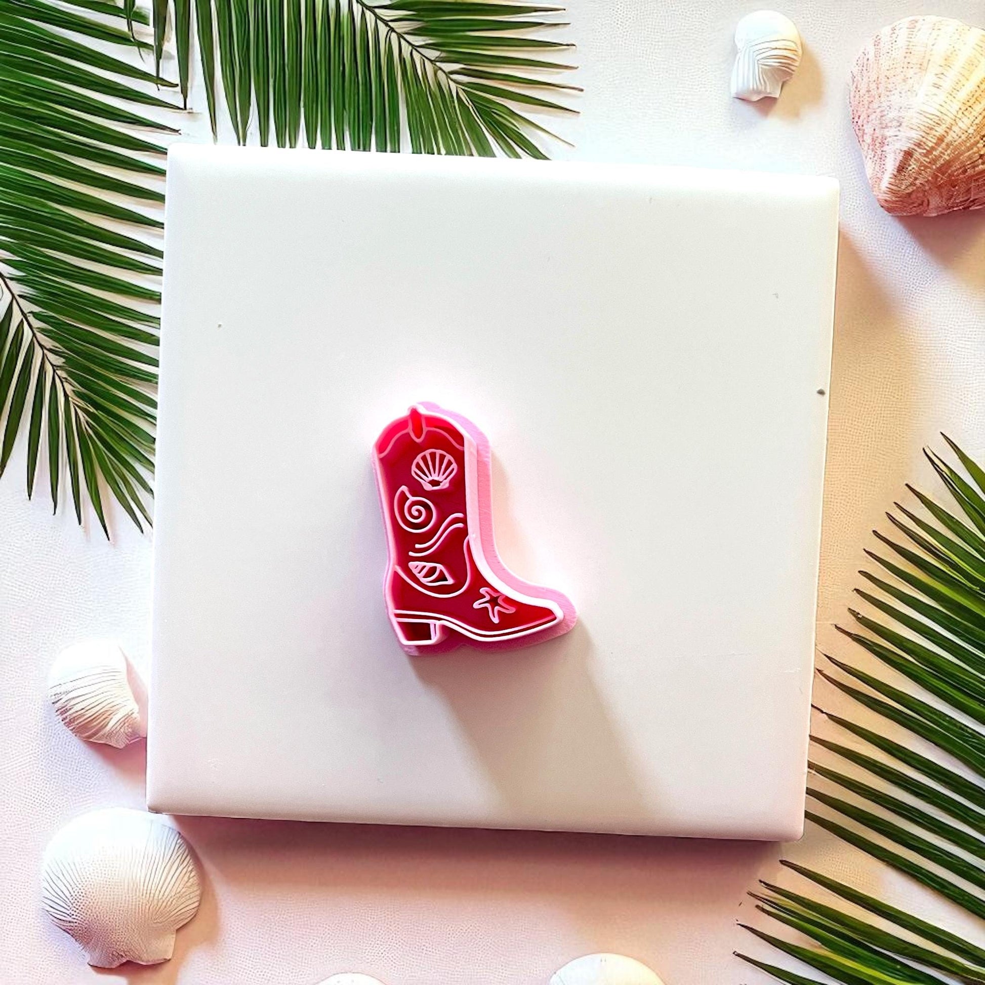 Red cowboy boot clay cutter with seashell design