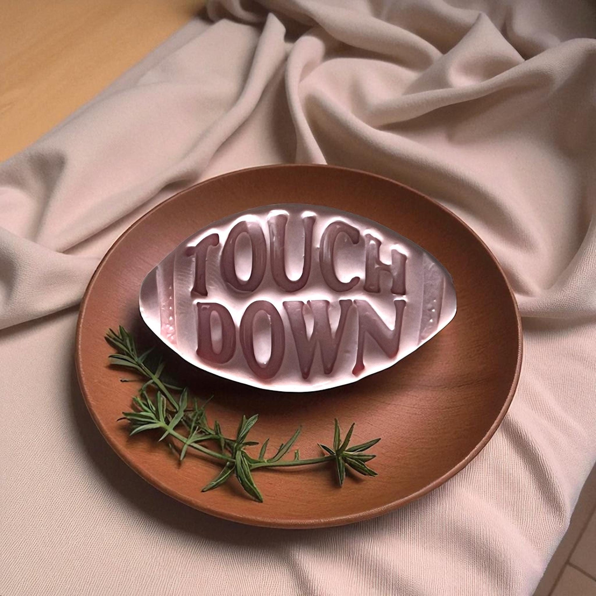 Touchdown football cutter with pink clay imprint side by side