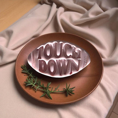 Touchdown football cutter with pink clay imprint side by side