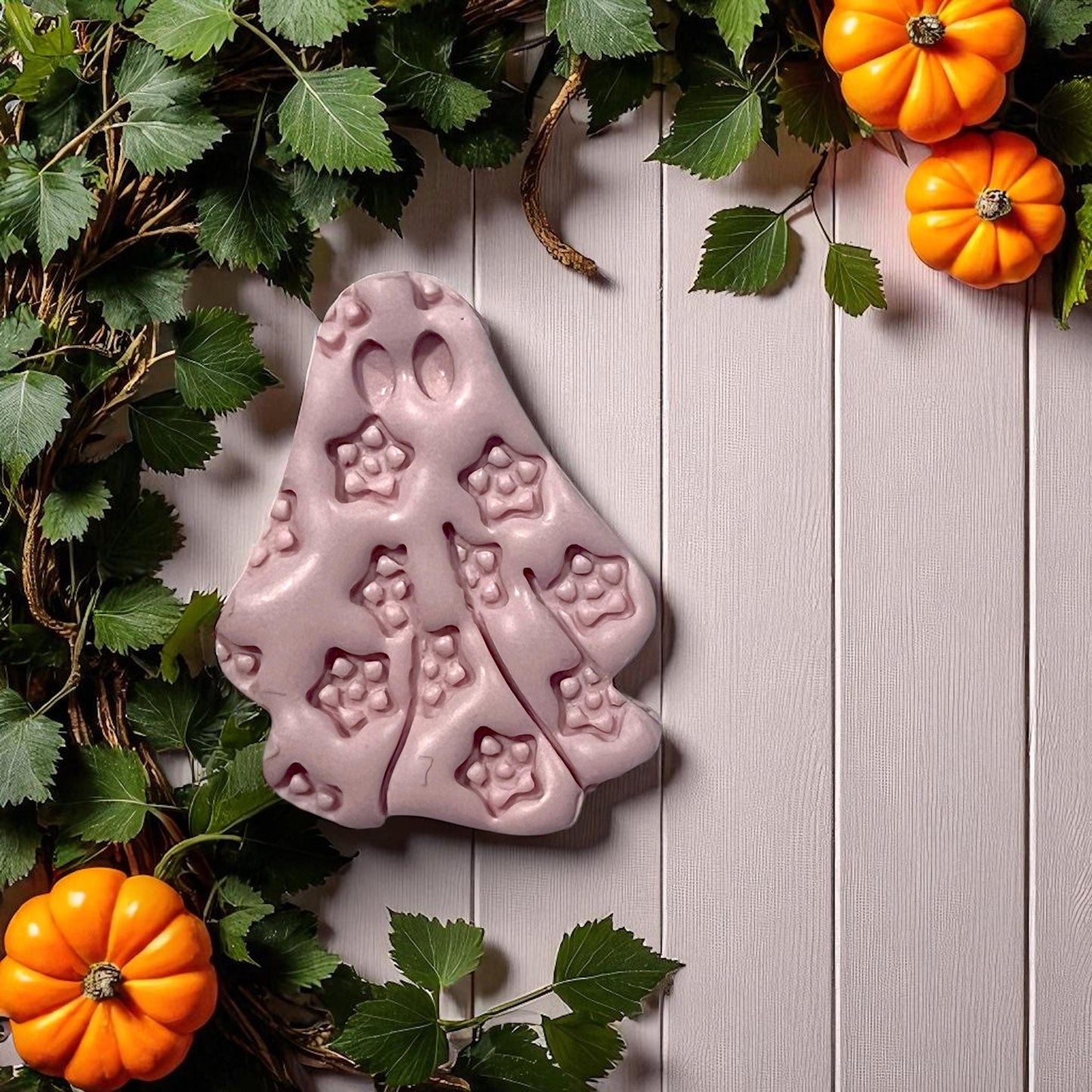 Large pink floral ghost clay design with leaves and pumpkins