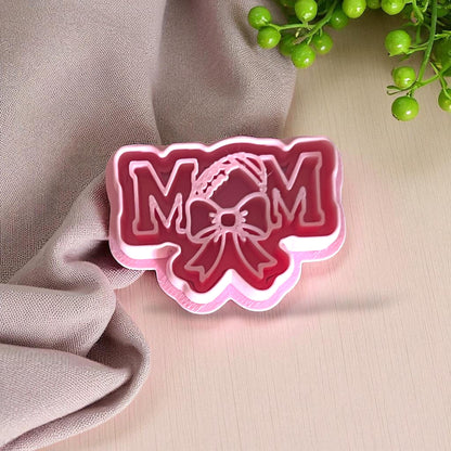 Pink football mom polymer clay cutter with bow detail