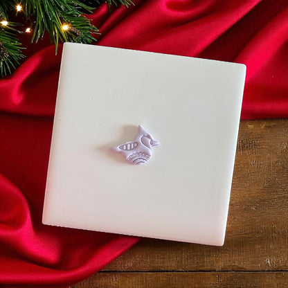 Small clay imprint of a holiday bird design