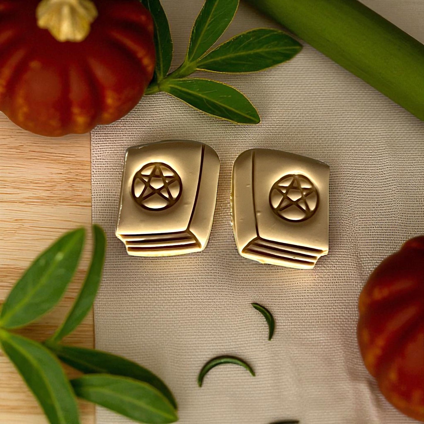 Gold clay spellbook designs with pentagram detail and pumpkins