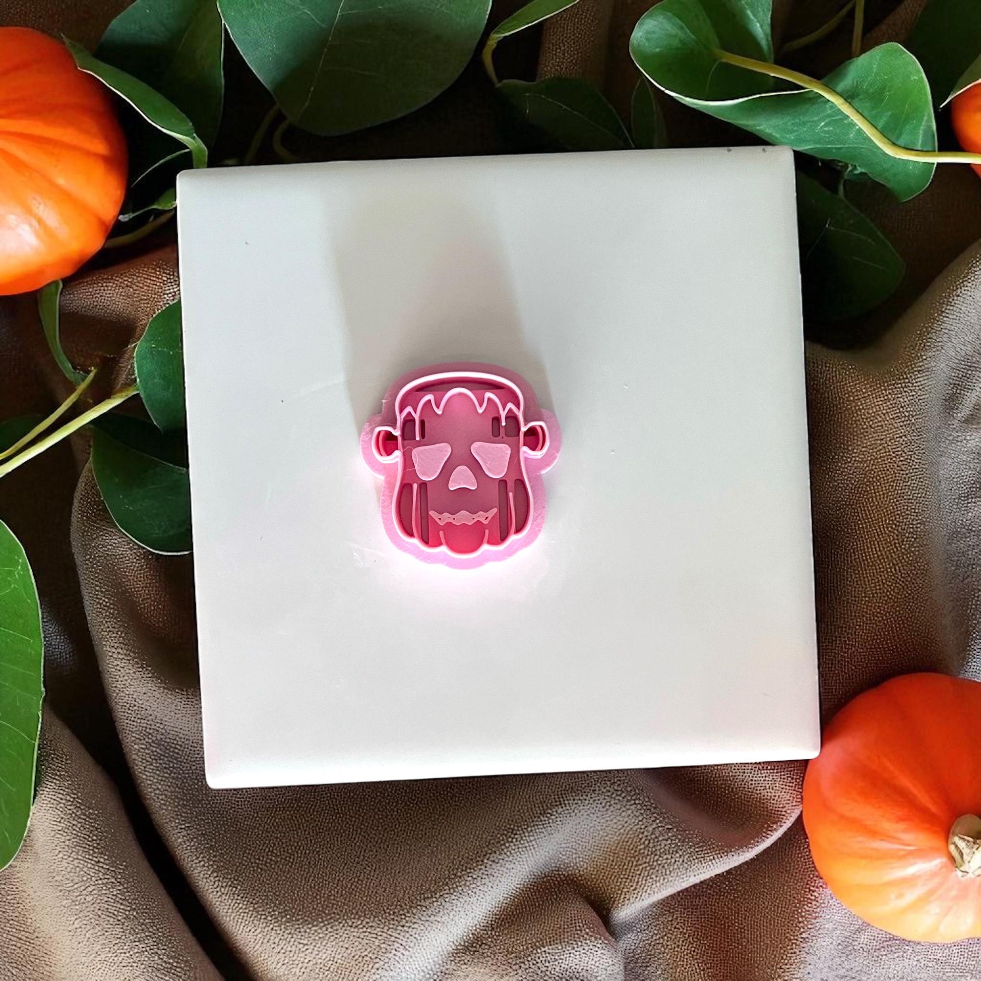 Pink Frankenstein pumpkin clay cutter on display