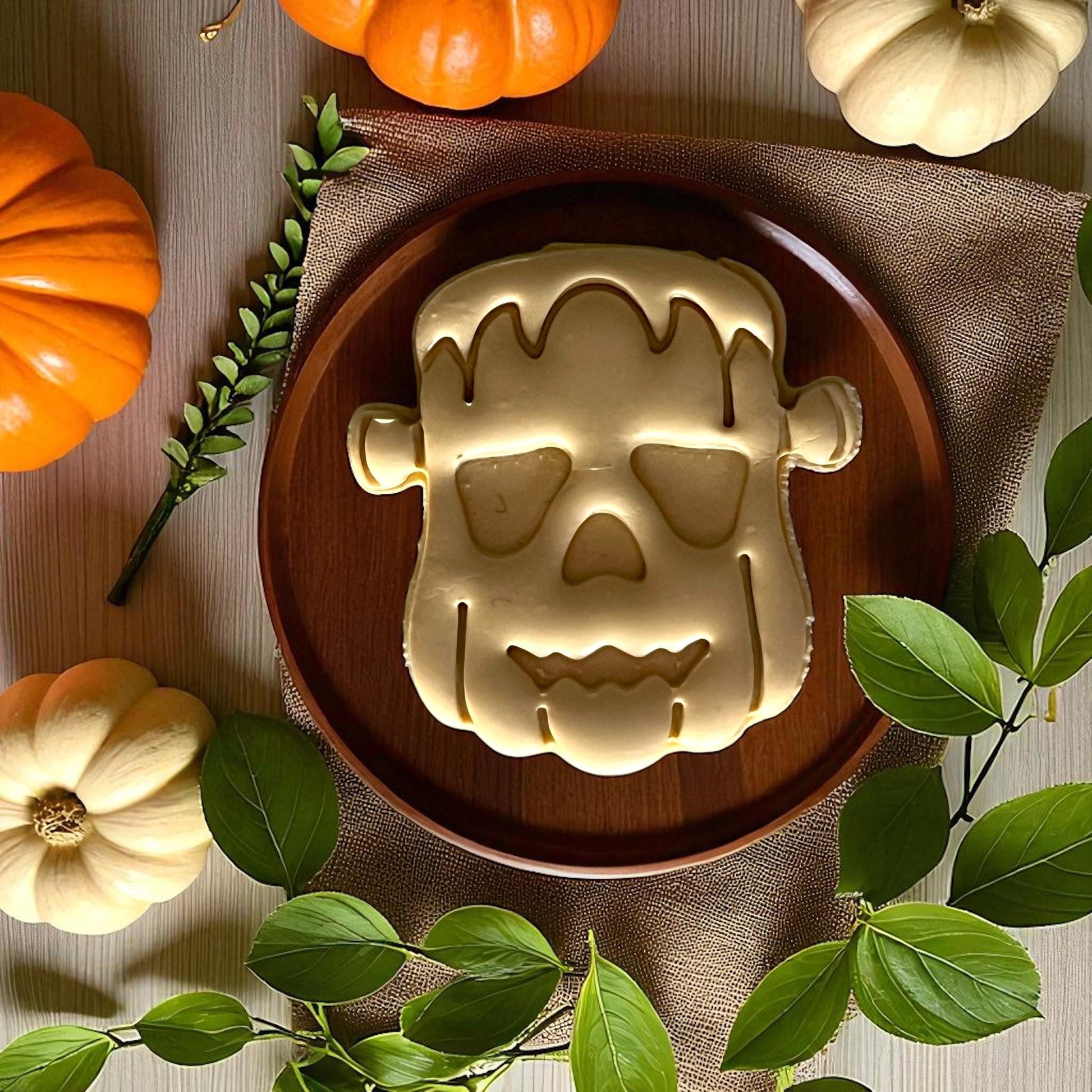 Large Frankenstein pumpkin clay imprint on wooden plate