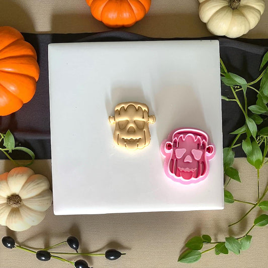 Frankenstein pumpkin clay imprint and pink cutter side by side